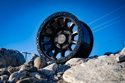 ICON Hulse 17 X 8.5 6 X 5.5 0mm Offset 4.75in BS Double Black wheel on rocks, perfect for performance car parts, DTX Performance