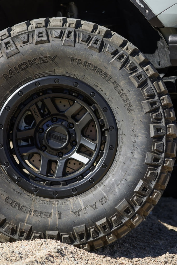 Mickey Thompson Baja Legend MTZ Tire on rugged terrain for high performance off-road capability and durability.