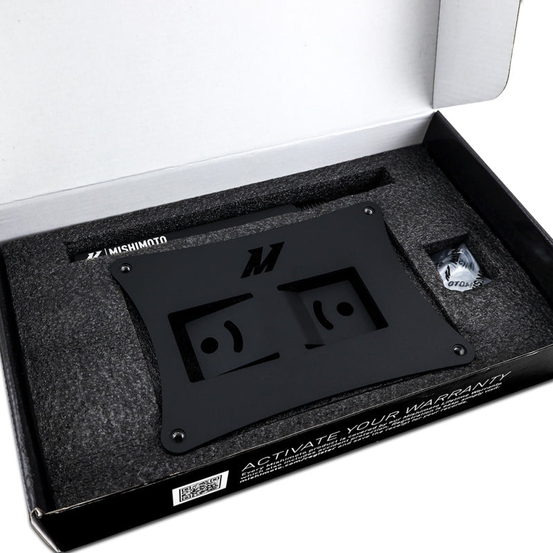 Mishimoto 2023+ Toyota GR Corolla License Plate Relocation Kit in packaging for high-performance car enthusiasts