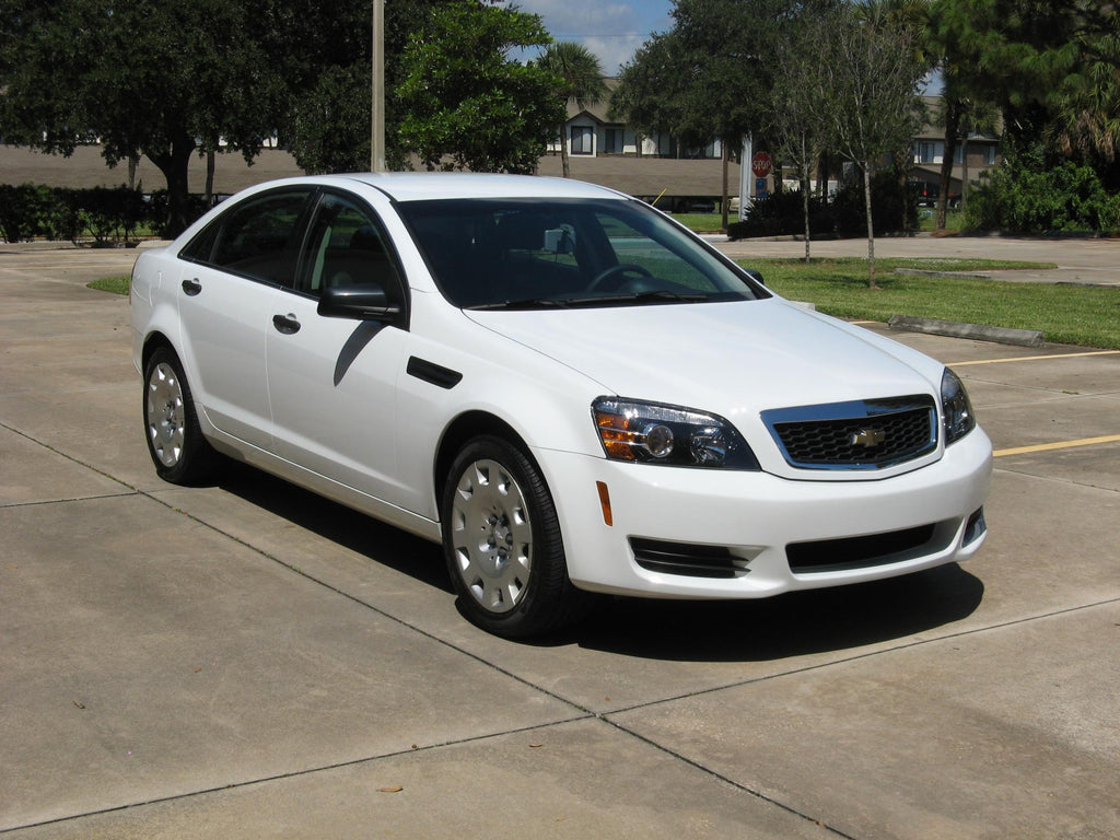 2011-13 Chevrolet Caprice Cold Air Intake With Oiled Filter installed in a white car. Performance car parts for enhanced tuning upgrades.
