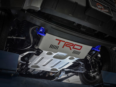 aFe Toyota Tundra 2022 V6-3.5L (tt) Front Tow Hook Blue in action on vehicle undercarriage