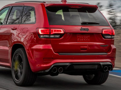 Borla 2018+ Jeep Grand Cherokee TrackHawk 6.2L V8 AWD 3in ATAK CatBack Exhaust on red vehicle, performance car components