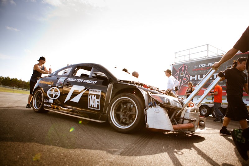 Race car preparation at track event