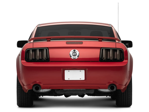 Raxiom 05-09 Ford Mustang Vector V2 LED Tail Lights- Black Housing (Smoked Lens) on a red Mustang, performance car parts