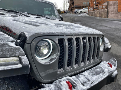 Oracle Lighting 18-22 Jeep Wrangler JL Oculus Bi-LED Projector Headlights on snowy mountain road