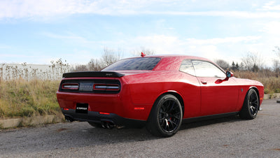 Corsa 2015-2023 Dodge Challenger Hellcat Dual Rear Exit Extreme Exhaust w/ 3.5in Black Tips on a red car