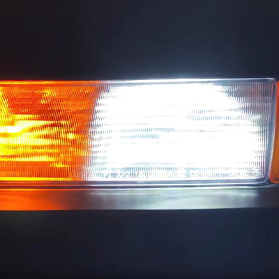 Oracle 7443 18 LED 3-Chip SMD Bulb - Cool White showcased in a car headlight, perfect for high performance auto parts and performance upgrades by DTX Performance.