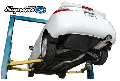 GReddy 06-11 Honda Civic Si 63.5mm Supreme SP Cat-Back Exhaust installed on a car lift at DTX Performance shop.