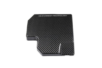 HKS DryCarbon Fuse Box Cover GR86/BRZ - Performance car parts from DTX Performance, boosting engine efficiency and aesthetics.