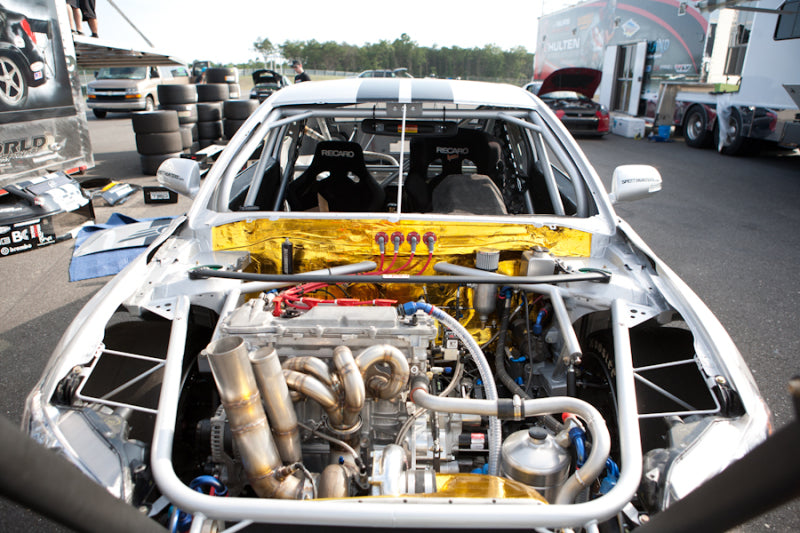 Open car engine with Mishimoto 2 Inch X 15 Feet Heat Defensive Reflective Tape applied