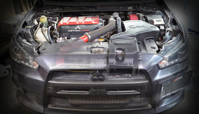 Injen 08-15 Mitsubishi Evo X 2.0L Evolution Intake installed in engine bay, showcasing performance upgrades for cars by DTX Performance.