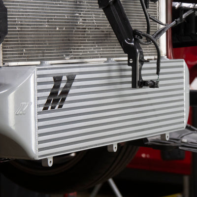 Mishimoto 2023+ Toyota GR Corolla Intercooler & Pipe Kit - Black Cooler - Red Pipes in high performance auto parts setup.