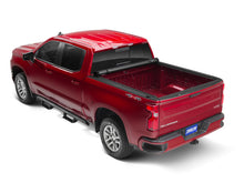 Load image into Gallery viewer, Tonno Pro 07-13 Chevy Silverado 1500 6.6ft Fleetside Lo-Roll Tonneau Cover installed on red truck