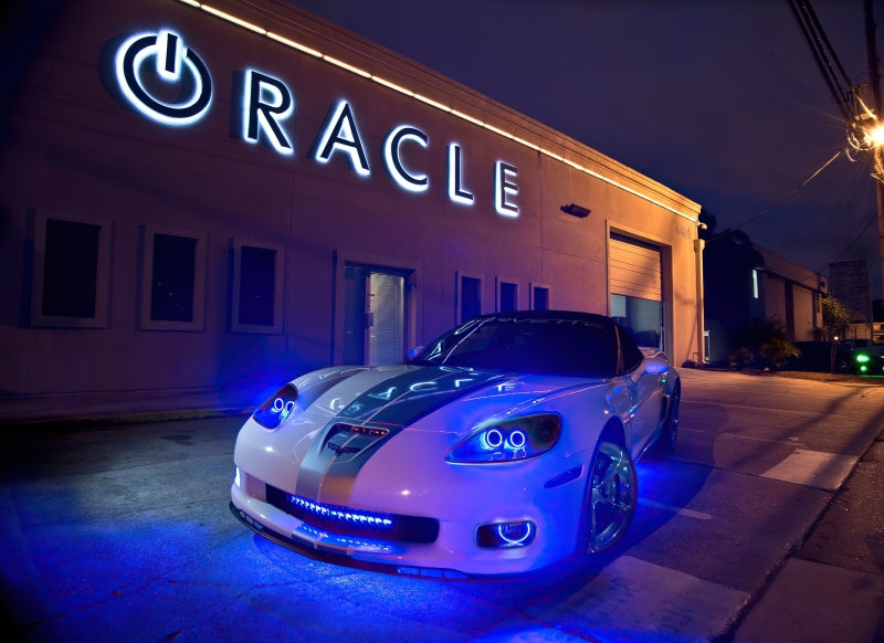 Oracle Universal Dynamic LED Underbody Kit - ColorSHIFT - Dynamic installed on a performance car outside DTX Performance shop at night