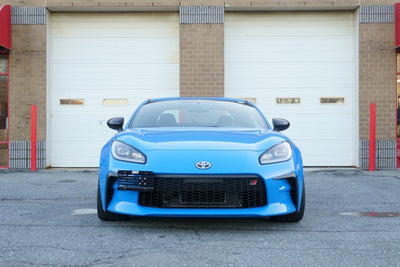 Turbo XS 2022+ Subaru WRX Towtag License Plate Relocation Kit on blue car, performance car parts upgrade at DTX Performance.