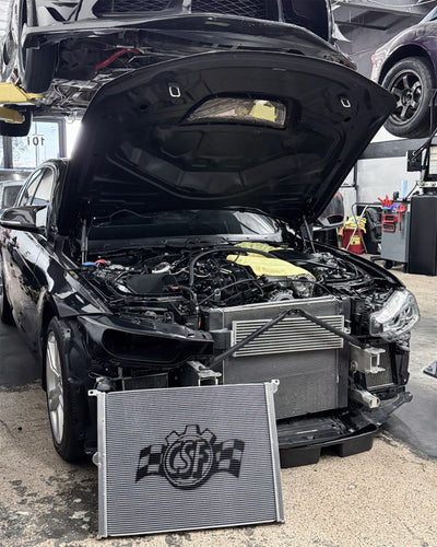 CSF BMW F-Chassis Gen 1 B58 High Performance All-Aluminum Radiator installation in progress at a veteran owned performance shop.