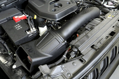 K&N 19-20 Jeep Wrangler JL 2.0L L4 F/I Turbo Performance Intake Kit in engine bay for performance upgrades