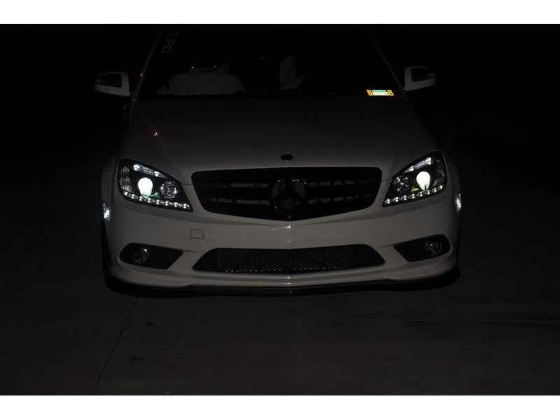Spyder Mercedes Benz C-Class 08-11 Projector Headlights Halogen - DRL Blk PRO-YD-MBW20408-DRL-BK showcasing nighttime visibility.
