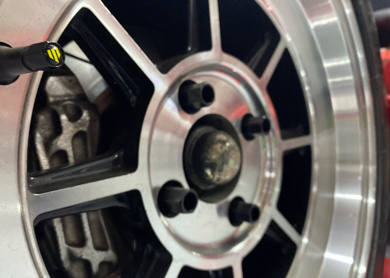 Whiteline Valve Caps(Set of 4) for alloy wheels, enhancing style and protection, available at DTX Performance, a veteran-owned shop.