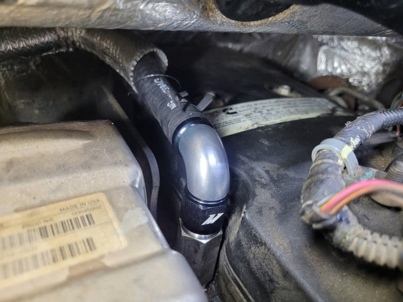 Mishimoto 2007.5+ Ram 6.7L Cummins Top Heater Hose Upgrade installed with performance car parts.