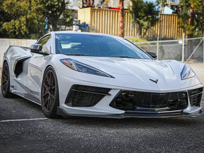 aFe 20-24 Chevrolet Corvette Control Front Tow Hook (Black) displayed on a white Corvette showcasing high performance car parts.