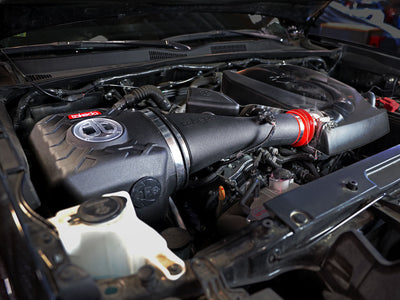aFe Takeda Momentum Cold Air Intake System installed in Toyota Tacoma V6-3.5L engine for performance upgrades at DTX Performance