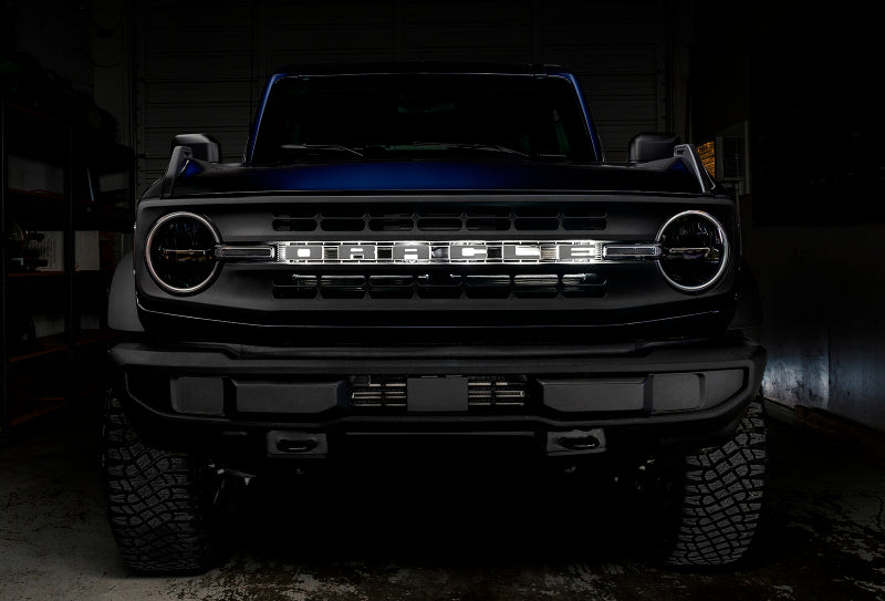 ORACLE Lighting Universal Illuminated LED Letter Badges - Matte Blk Surface Finish - R on a performance car in a garage