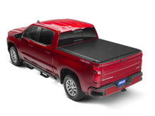 Load image into Gallery viewer, Tonno Pro 07-13 Chevy Silverado 1500 6.6ft Fleetside Lo-Roll Tonneau Cover installed on red truck, performance car parts