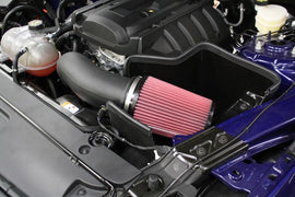 JLT 15-19 Ford Mustang 2.3L EcoBoost Black Textured Cold Air Intake Kit w/Red Filter displayed in engine bay