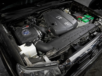 aFe Momentum GT Dynamic Air Scoop 12-15 Toyota Tacoma V6 4.0L in engine bay, enhancing airflow for high performance.