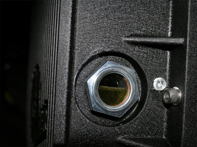 aFe Sight Glass for differential cover with performance car parts, showing oil level for upgraded engine performance.