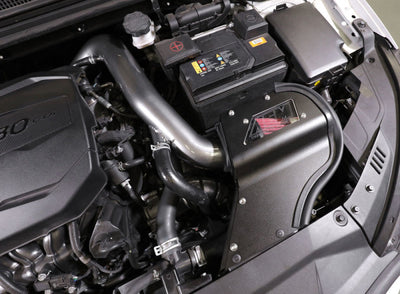 AEM C.A.S. 19-20 Hyundai Veloster L4-1.6L F/I Cold Air Intake installed in a performance car engine for enhanced power.