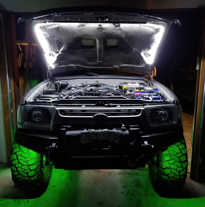 Oracle Bluetooth + RF Underbody Rock Light Kit - 8 PCS - ColorSHIFT on off-road vehicle showing green lighting effect