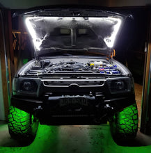 Load image into Gallery viewer, Oracle Bluetooth + RF Underbody Rock Light Kit - 8 PCS - ColorSHIFT on off-road vehicle showing green lighting effect