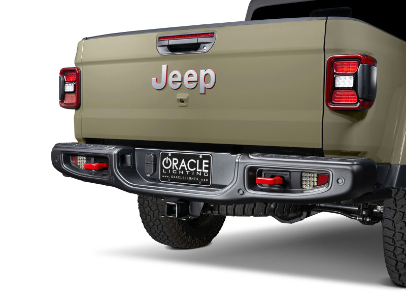 Oracle Rear Bumper LED Reverse Lights for Jeep Gladiator JT - 6000K installed on back of a Jeep, showcasing performance car parts.