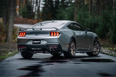 MBRP 2024+ Ford Mustang 5.0L T304 SS 3in Cat-Back Dual Split Exhaust w/ Quad Tips (Valve Delete) on a silver Mustang.