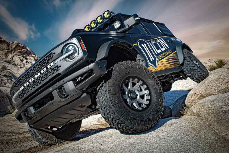 ICON 21-UP Ford Bronco 2-3in Front 2.5 VS RR COILOVER KIT installed on rocky terrain for performance upgrade