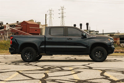 Corsa 2022-2024 Chevrolet Silverado 1500 Cat-Back Dual Rear Exit with Twin 4in Black Tips parked on street