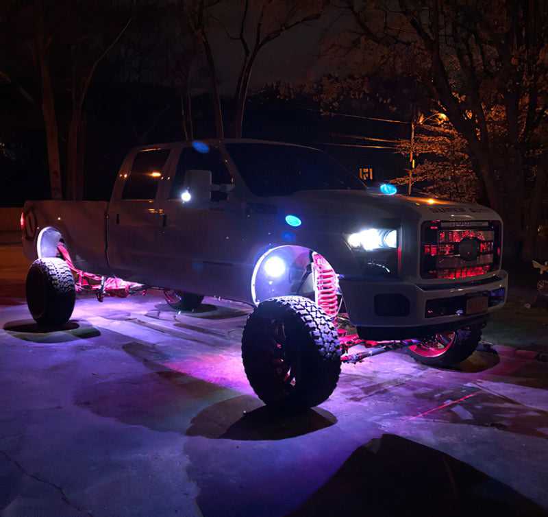 Oracle Bluetooth + RF Underbody Rock Light Kit - 8 PCS - ColorSHIFT installed on a truck at night, part of DTX Performance upgrades.