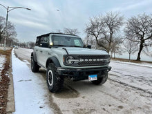 Load image into Gallery viewer, Gray off-road vehicle parked on snowy street.