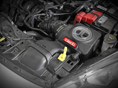 aFe Takeda Momentum Pro 5R Cold Air Intake System 14-19 Ford Fiesta L4-1.6L engine bay installed, enhances performance.