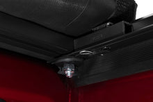 Load image into Gallery viewer, Tonno Pro 17-19 Ford F-250/F-350 Super Duty 6.8ft Bed Lo-Roll Tonneau Cover installation detail.