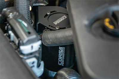 Corsa 2018-2023 Ford Mustang GT 5.0L V8 Oil Catch Can in engine bay, performance car parts by DTX Performance.