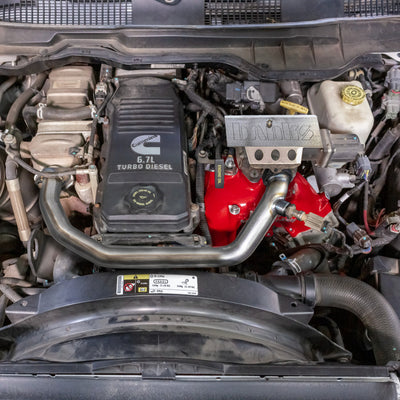 Banks Power 07.5-12 Ram Cab Chassis 6.7L Diesel Monster-Ram Intake System w/Fuel Line - Red in engine bay, performance car parts.