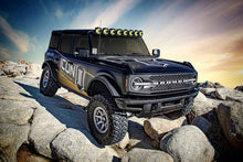 Load image into Gallery viewer, ICON 21-UP Ford Bronco 2-3in Front 2.5 VS RR COILOVER KIT on rocky terrain, performance upgrades by DTX Performance