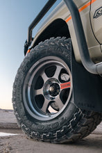 Load image into Gallery viewer, Off-road tire on a vehicle in desert