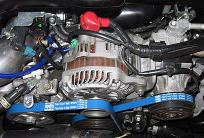 HKS FINE TUNE V-BELT/6PK1905 on car engine, ideal for performance upgrades and tuning, available at veteran owned DTX Performance shop.