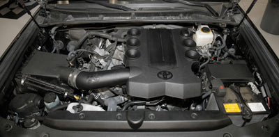 K&N 15-19 Toyota 4 Runner V6-4.0L Performance Air Intake Kit in engine bay, aftermarket performance part