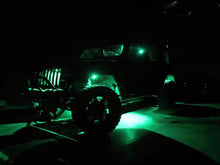 Load image into Gallery viewer, Oracle Bluetooth + RF Underbody Rock Light Kit illuminated on off-road vehicle, showcasing ColorSHIFT technology for performance car tuning.