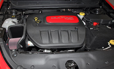 K&N 13-14 Dodge Dart 1.4L Silver Typhoon Performance Intake in engine bay with high performance parts from veteran-owned shop.